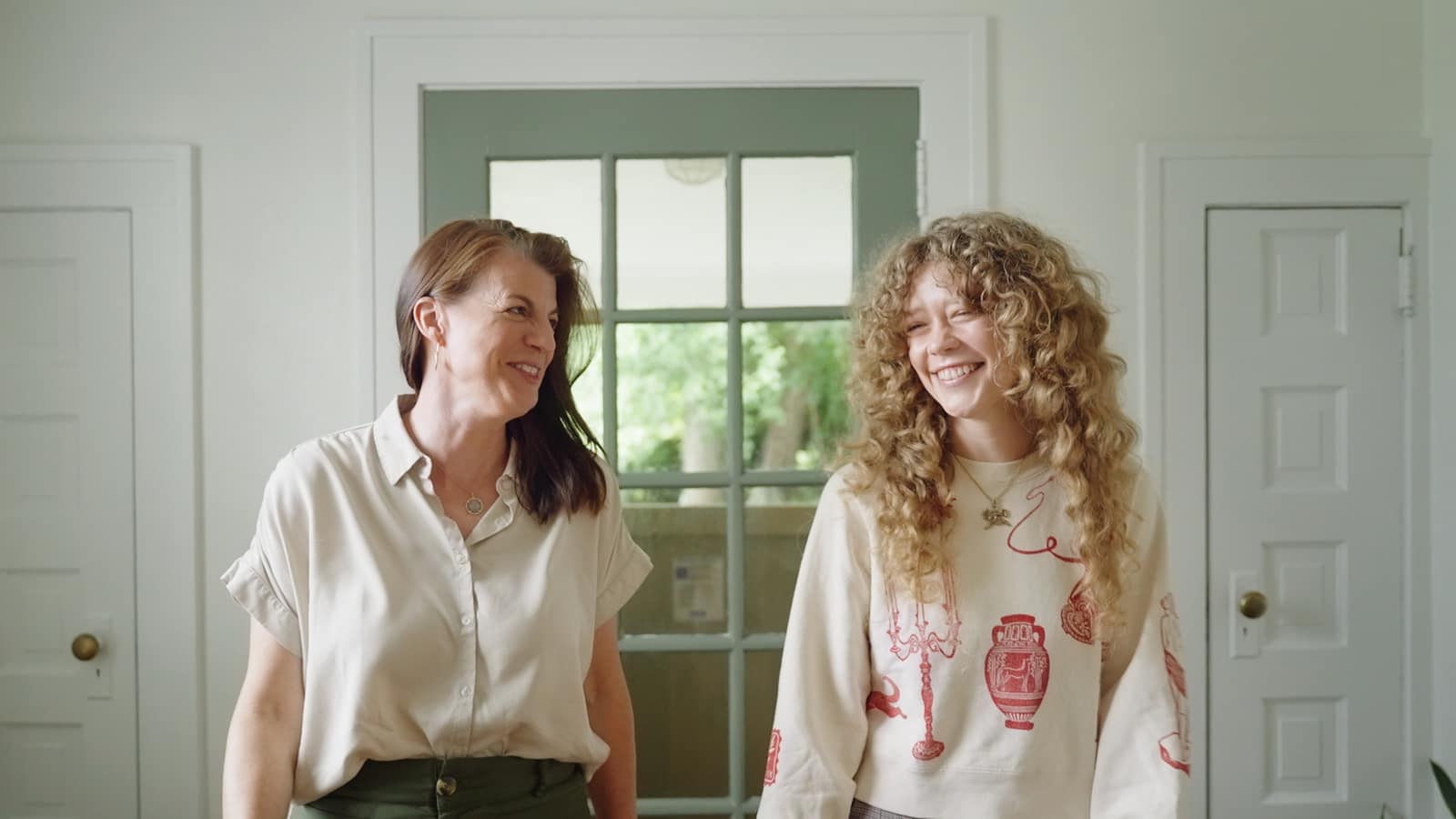 Two people sharing a warm, welcoming moment at Your Next Chapter Counseling